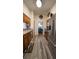 Bright kitchen featuring wooden cabinets, stainless steel appliances and luxury vinyl flooring at 901 Candle Berry Rd, Orlando, FL 32825