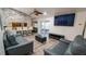Contemporary living room featuring stylish seating, a stone accent wall, and an open layout at 901 Candle Berry Rd, Orlando, FL 32825