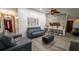 Modern living room featuring stylish seating, a stone accent wall, and an open layout at 901 Candle Berry Rd, Orlando, FL 32825