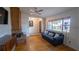 Inviting living room with a fireplace, hardwood floors, and a comfortable blue sofa at 901 Candle Berry Rd, Orlando, FL 32825
