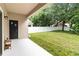 Spacious backyard with a white fence and a covered patio, offering privacy at 9067 Stonebury Way, Orlando, FL 32832