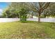 Expansive backyard featuring a well-maintained lawn and privacy fence perfect for outdoor activities and relaxation at 9067 Stonebury Way, Orlando, FL 32832