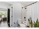 Bathroom featuring a shower with white subway tile and a decorative cactus shower curtain at 9067 Stonebury Way, Orlando, FL 32832