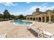 Beautiful community pool with lounge chairs and a spacious deck for residents to enjoy at 9067 Stonebury Way, Orlando, FL 32832