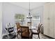 Breakfast nook features new floors, natural light, and seating for four at 9067 Stonebury Way, Orlando, FL 32832