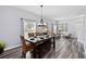 Dining room features new flooring, and lots of natural light from multiple windows at 9067 Stonebury Way, Orlando, FL 32832