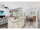 Kitchen features stainless steel appliances, granite countertops, and is open to the living area at 9067 Stonebury Way, Orlando, FL 32832