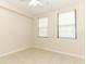 Neutral bedroom with ceiling fan, tile floor, and two large windows at 911 N Orange Ave # 143, Orlando, FL 32801