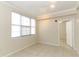 Bright bedroom with tile flooring, large window, and convenient access to other rooms at 911 N Orange Ave # 143, Orlando, FL 32801