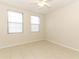 Well-lit bedroom with tile flooring and multiple windows at 911 N Orange Ave # 143, Orlando, FL 32801