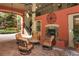 Inviting courtyard with comfortable seating surrounding a fireplace, perfect for relaxation and socializing at 911 N Orange Ave # 143, Orlando, FL 32801