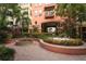Beautiful courtyard showcasing lush landscaping, a fountain, and attractive architectural details of the building at 911 N Orange Ave # 143, Orlando, FL 32801