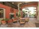 Serene courtyard featuring an outdoor fireplace and comfortable seating, ideal for relaxation and socializing at 911 N Orange Ave # 143, Orlando, FL 32801