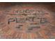 Brick circle with 'Uptown Place' inlaid in dark stone at 911 N Orange Ave # 143, Orlando, FL 32801