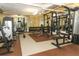 Functional gym space with weight machines, free weights, and mirrored walls for a complete fitness routine at 911 N Orange Ave # 143, Orlando, FL 32801