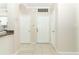 Clean hallway with tile flooring, neutral walls, and multiple entryways at 911 N Orange Ave # 143, Orlando, FL 32801