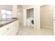 Laundry room includes washer, dryer and wire shelving at 911 N Orange Ave # 143, Orlando, FL 32801