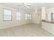 Inviting living area with tile floors, ceiling fan, and large windows for natural light at 911 N Orange Ave # 143, Orlando, FL 32801