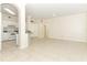 Open-concept living area with tile flooring, kitchen view, and ample natural light at 911 N Orange Ave # 143, Orlando, FL 32801
