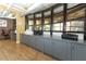 Workspace featuring laminate floor, grey cabinets and a printer station at 911 N Orange Ave # 143, Orlando, FL 32801