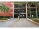 Parking garage entrance with security gate for resident's vehicle protection at 911 N Orange Ave # 143, Orlando, FL 32801