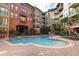 Beautiful pool area surrounded by lush landscaping, providing a resort-like atmosphere for residents to enjoy at 911 N Orange Ave # 143, Orlando, FL 32801