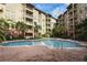 Inviting pool area features a spacious pool, comfortable lounge chairs, and lush landscaping for relaxation at 911 N Orange Ave # 143, Orlando, FL 32801