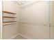 Spacious walk-in closet featuring wire and wood shelving at 911 N Orange Ave # 143, Orlando, FL 32801