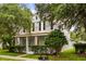 Charming two-story home with a welcoming front porch and well-manicured landscaping at 10117 Sweetleaf St, Orlando, FL 32827