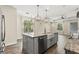 Spacious kitchen island with a farmhouse sink and granite countertop, perfect for entertaining at 10117 Sweetleaf St, Orlando, FL 32827
