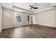 Open living room with wood floors, recessed lighting, and a ceiling fan at 10117 Sweetleaf St, Orlando, FL 32827