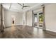 Spacious, naturally lit living room boasts wood-look tile floors and sliding glass doors to an outdoor area at 10117 Sweetleaf St, Orlando, FL 32827