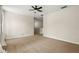 Neutral room with carpet, white trim, and a view of a second floor landing at 10117 Sweetleaf St, Orlando, FL 32827