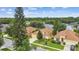 Aerial view showcasing a single-Gathering home with a well-kept lawn, mature landscaping, and neighborhood streets at 1041 Cherry Valley Way, Orlando, FL 32828