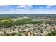 Expansive aerial view of a residential community with lush surroundings and multiple ponds at 1041 Cherry Valley Way, Orlando, FL 32828