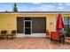 Cozy back patio with a brick surface, perfect for outdoor entertaining and relaxation at 1041 Cherry Valley Way, Orlando, FL 32828