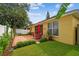 Lush backyard with a brick patio, an outdoor dining set, and manicured landscaping at 1041 Cherry Valley Way, Orlando, FL 32828