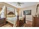 Relaxing bedroom with hardwood floors, a ceiling fan, and natural light at 1041 Cherry Valley Way, Orlando, FL 32828