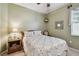 Cozy bedroom featuring a comfortable bed, complemented by a charming nightstand and soft, natural lighting at 1041 Cherry Valley Way, Orlando, FL 32828