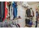 Well-organized walk-in closet with wire shelving, offering ample storage space for clothes and accessories at 1041 Cherry Valley Way, Orlando, FL 32828