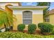 Exterior home detail with mature landscaping at 1041 Cherry Valley Way, Orlando, FL 32828