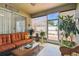 Relaxing Florida room with a comfortable sofa and an open view of the backyard at 1041 Cherry Valley Way, Orlando, FL 32828