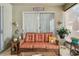 Comfortable seating arrangement in this Florida room, with a relaxing view of the backyard at 1041 Cherry Valley Way, Orlando, FL 32828