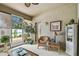 Enclosed Florida room featuring a comfortable seating arrangement and an abundance of natural light at 1041 Cherry Valley Way, Orlando, FL 32828