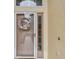 Front door with glass and decorative wreath at 1041 Cherry Valley Way, Orlando, FL 32828
