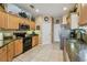 Well-lit kitchen with stainless steel appliances and ample cabinet space, ready for cooking at 1041 Cherry Valley Way, Orlando, FL 32828