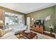 Inviting living room with a neutral color scheme and sliding glass doors at 1041 Cherry Valley Way, Orlando, FL 32828