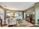 Comfortable living room with hardwood floors, couches, and a decorative rug at 1041 Cherry Valley Way, Orlando, FL 32828