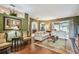 Spacious living room with hardwood floors, arched doorways, and stylish furniture at 1041 Cherry Valley Way, Orlando, FL 32828