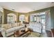 Open-concept living room with hardwood floors and lots of light at 1041 Cherry Valley Way, Orlando, FL 32828